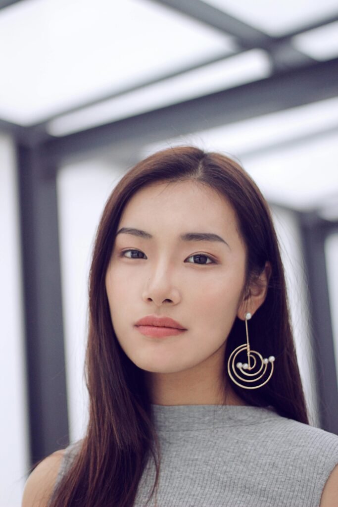 pexels-photo-3284696-3284696 Stunning Asian woman with stylish earrings posing indoors. Modern fashion and elegance meet in this captivating portrait.